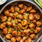 Honey garlic chicken easy recipe in skillet with green onions