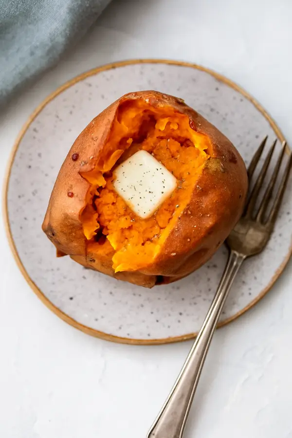 Served air fryer baked sweet potato with fork