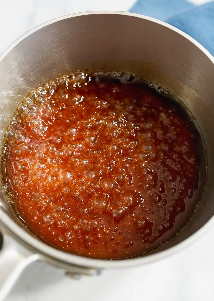 Brown sugar syrup boiling in pot