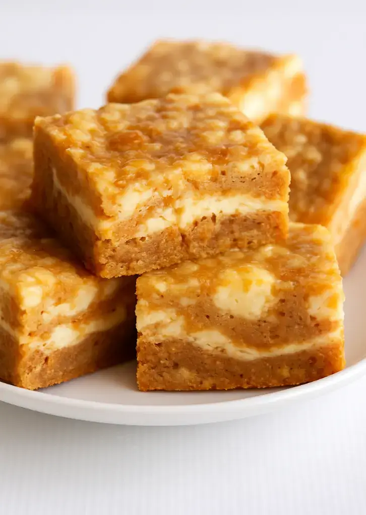 Close-up of moist carrot cake bars with cheesecake swirl