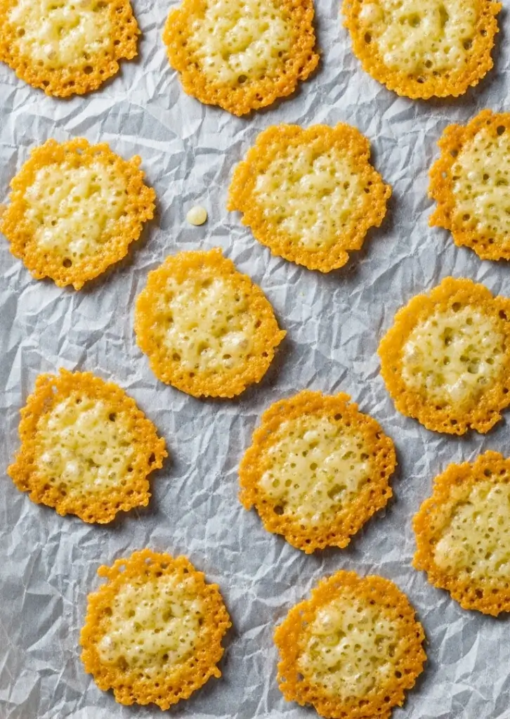 Baked Air Fryer Cottage Cheese Chips cooling on parchment