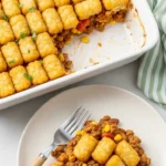Plated cowboy casserole with tater tots and beef filling