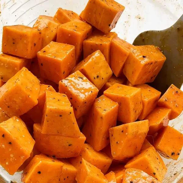 Sweet potato cubes seasoned with oil and spices