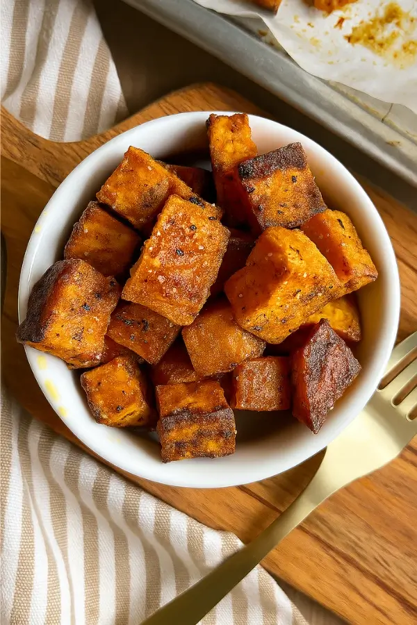 Roasted sweet potato cubes served hot in bowl