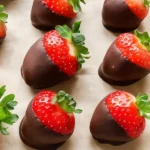 tray of freshly dipped strawberries in chocolate