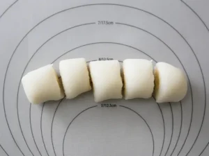 Rolled Korean rice cake dough sliced into small pieces