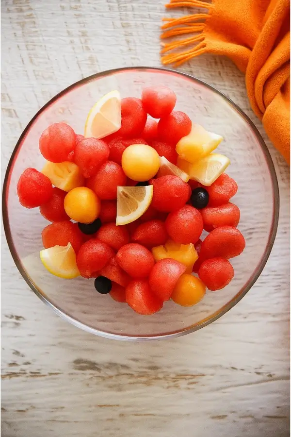 Glass bowl of mixed fruit for Korean watermelon punch