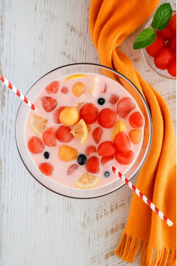 Korean watermelon punch with strawberry milk base in glass bowl