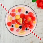 Top view of Korean watermelon punch with pink base and fruit