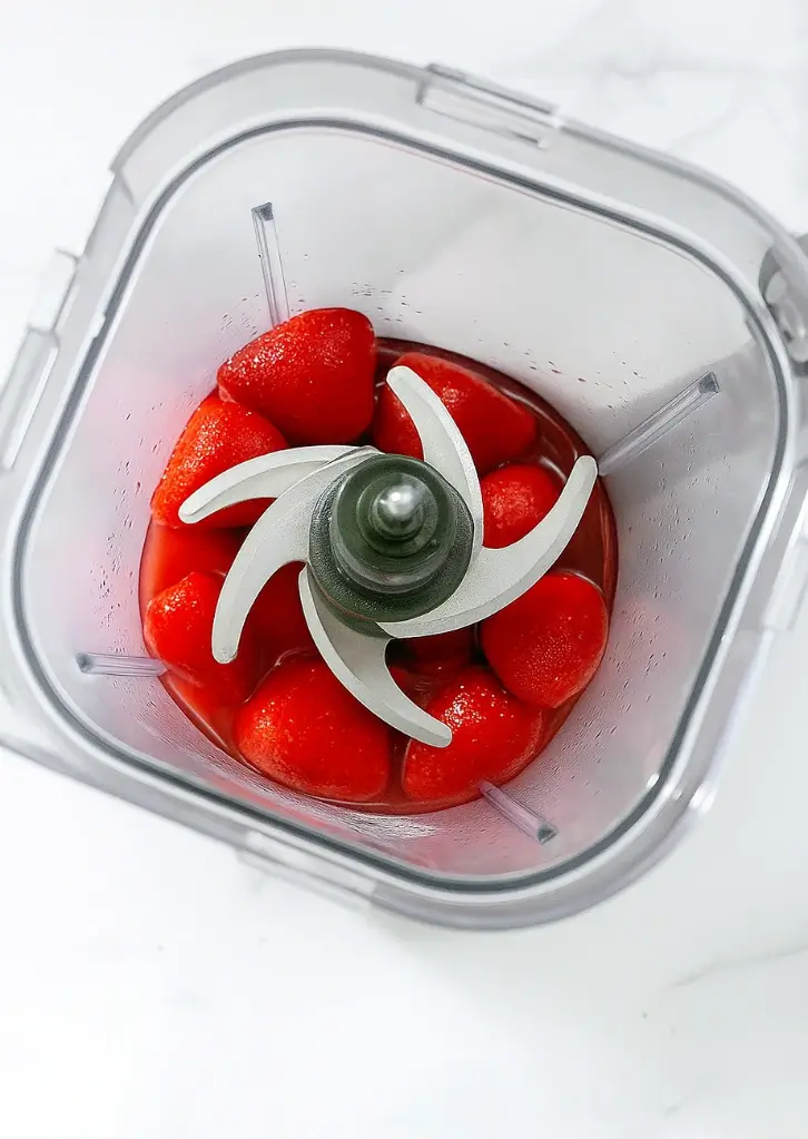Fresh strawberries in blender ready to puree