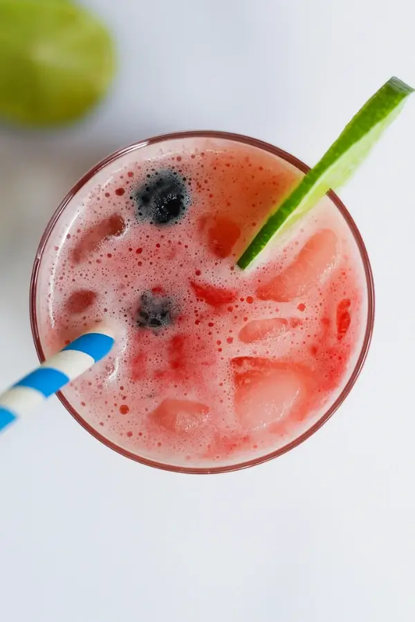 Top view of easy virgin strawberry margarita with lime