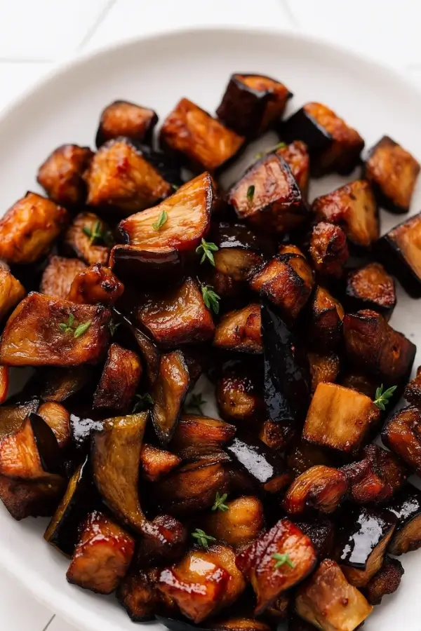 Air-fried eggplant cubes garnished with fresh herbs