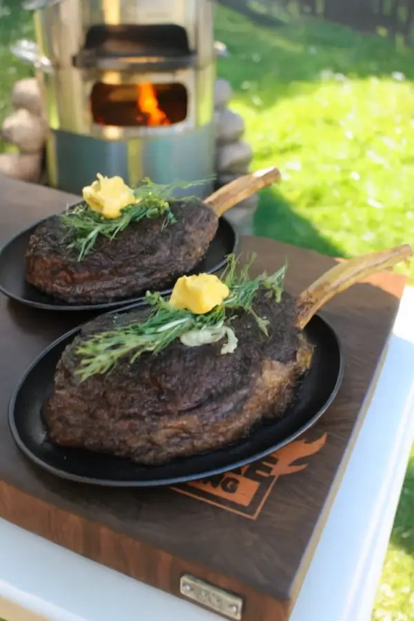 Grilled Tomahawk Scorpion Steak with fresh herbs and butter