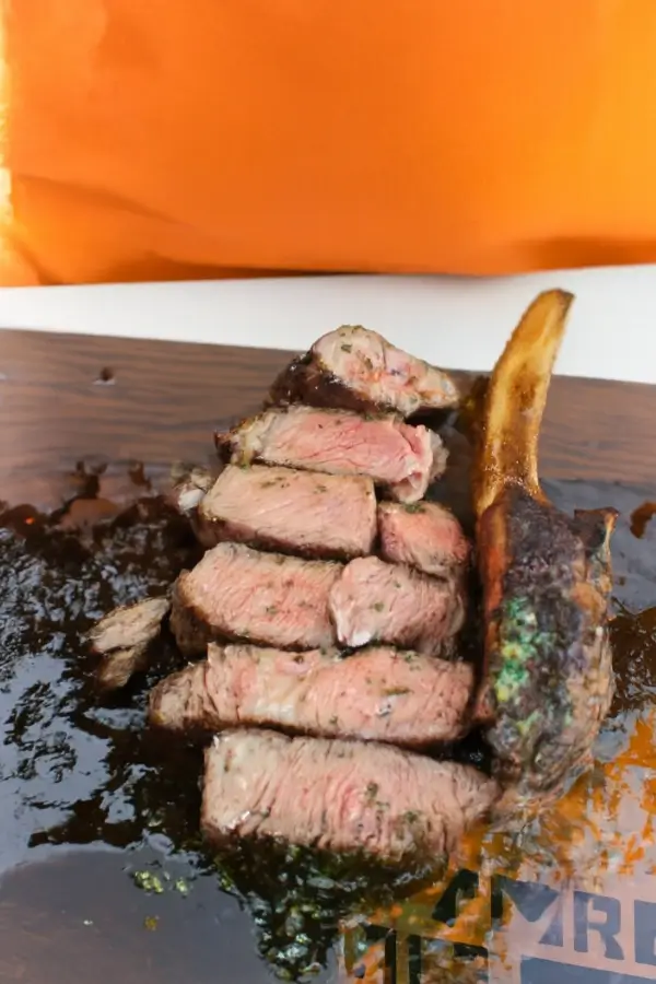 Sliced Tomahawk Scorpion Steak showing a perfect medium-rare cook